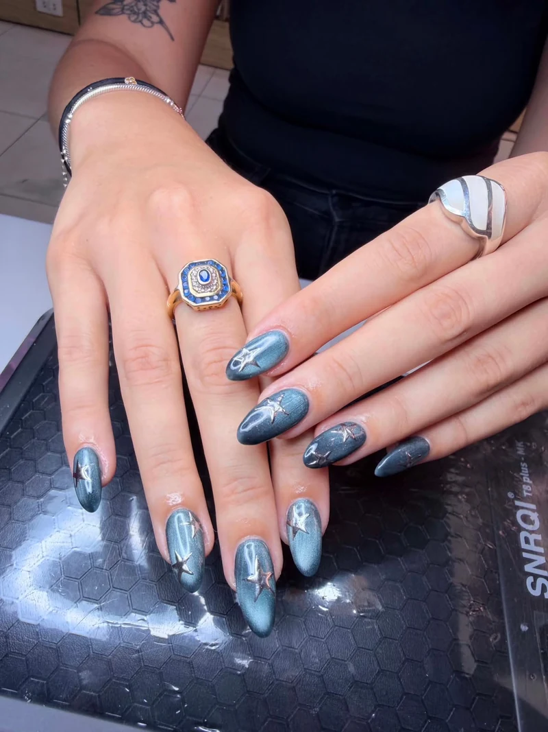 Blue nail art with reflective accents