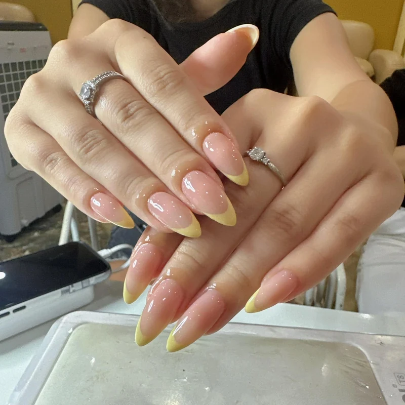 Pink and yellow French almond nails
